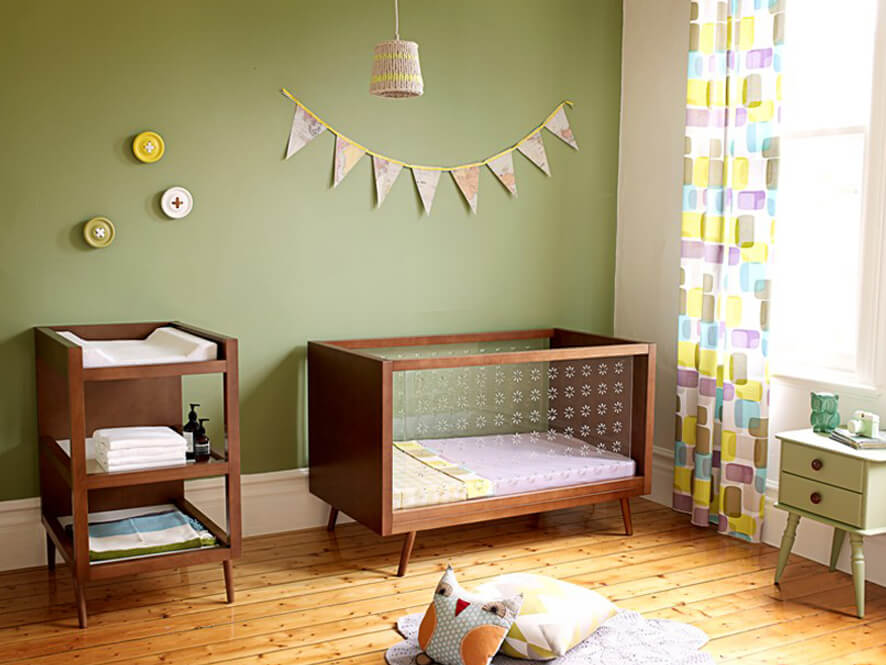 earthy_green_nursery_timber_floorboards_natural_wood_floorboards_buttons_flags_green_bedside_table
